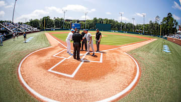 Jun 8, 2025; Chapel Hill, NC, USA; North Carolina Head Coach Scott Forbes and Arizona Head Coach Chip Hale meet before the first inning of the Super Regionals game in Chapel Hill, North Carolina. Mandatory Credit: Jaylynn Nash-Imagn Images
