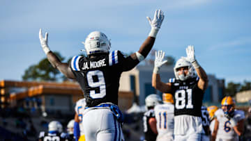 Nov 25, 2023; Durham, North Carolina, USA; Duke Blue Devils running back Jaquez Moore (9) and Duke Blue Devils tight end Nicky Dalmolin (81) celebrate against the Pitt Panthers