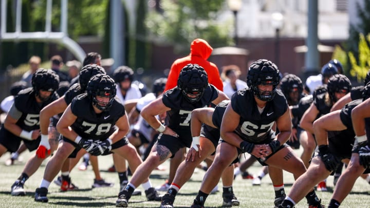 Oregon State football players warm up before a practice on Wednesday, July 31, 2024 in Corvallis, Ore.