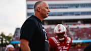 Aug 28, 2025; Raleigh, North Carolina, USA; North Carolina State Wolfpack head coach Dave Doeren looks on during the warmups prior to the game against East Carolina Pirates at Carter-Finley Stadium. Mandatory Credit: Jaylynn Nash-Imagn Images