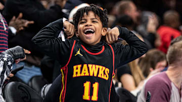 Jan 15, 2024; Atlanta, Georgia, USA; Fan celebrating Atlanta Hawks shot against San Antonio Spurs during the fourth quarter at State Farm Arena. Mandatory Credit: Jordan Godfree-Imagn Images