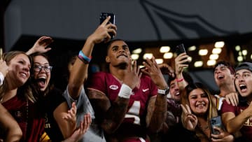 Nov 18, 2023; Tallahassee, Florida, USA; Florida State Seminoles wide receiver Keon Coleman (4) celebrates the win against the North Alabama Lions with fans at Doak S. Campbell Stadium. Mandatory Credit: Morgan Tencza-USA TODAY Sports