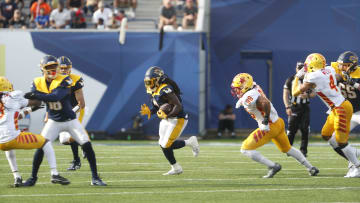 The Memphis Showboats running back Alex Collins (2) rushes the ball against the Philadelphia Stars