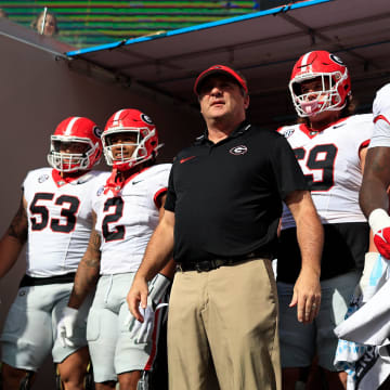 Georgia Bulldogs head coach Kirby Smart, center, prepares to lead, from left, offensive lineman Dylan Fairchild (53), running back Kendall Milton (2), offensive lineman Tate Ratledge (69), defensive lineman Zion Logue (96), and linebacker Jalon Walker (11) onto the field before an NCAA football game Saturday, Oct. 28, 2023 at EverBank Stadium in Jacksonville, Fla. Georgia defeated Florida 43-20. [Corey Perrine/Florida Times-Union]