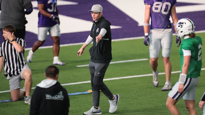 Kansas State quarterbacks coach Christian Ellsworth talks to players during practice on Tuesday, April 21, 2026.