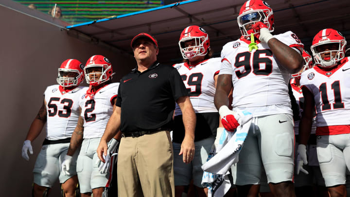 Georgia Bulldogs head coach Kirby Smart, center, prepares to lead, from left, offensive lineman Dylan Fairchild (53), running back Kendall Milton (2), offensive lineman Tate Ratledge (69), defensive lineman Zion Logue (96), and linebacker Jalon Walker (11) onto the field before an NCAA football game Saturday, Oct. 28, 2023 at EverBank Stadium in Jacksonville, Fla. Georgia defeated Florida 43-20. [Corey Perrine/Florida Times-Union]