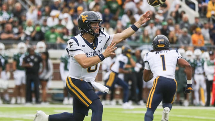 Sep 6, 2025; Athens, Ohio, USA; West Virginia Mountaineers quarterback Nicco Marchiol (8) throws a pass during the first quarter against the Ohio Bobcats at Peden Stadium. Mandatory Credit: Ben Queen-Imagn Images Sep 6, 2025; Athens, Ohio, USA; West Virginia Mountaineers quarterback Nicco Marchiol (8) throws a pass during the first quarter against the Ohio Bobcats at Peden Stadium. Mandatory Credit: Ben Queen-Imagn Images