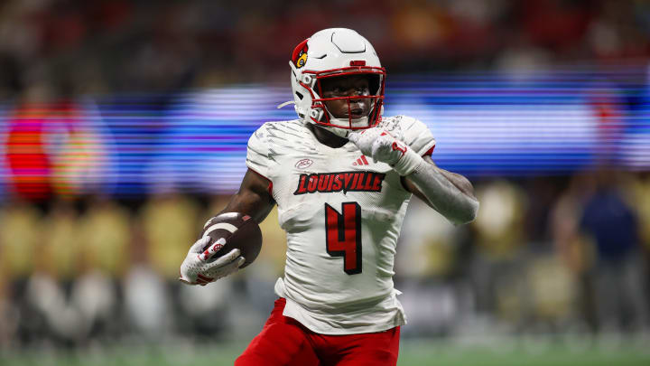 Sep 1, 2023; Atlanta, Georgia, USA; Louisville Cardinals running back Maurice Turner (4) runs the ball against the Georgia Tech Yellow Jackets in the second half at Mercedes-Benz Stadium. 