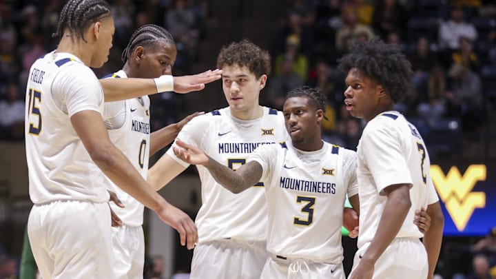 Dec 22, 2025; Morgantown, West Virginia, USA; West Virginia Mountaineers guard Honor Huff (3) celebrates with teammates after a made basket during the second half against the Mississippi Valley State Delta Devils at Hope Coliseum. Mandatory Credit: Ben Queen-Imagn Images