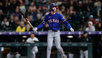 May 10, 2024; Denver, Colorado, USA; Texas Rangers outfielder Evan Carter (32) after striking out in the eighth inning against the Colorado Rockies at Coors Field. Mandatory Credit: Isaiah J. Downing-Imagn Images