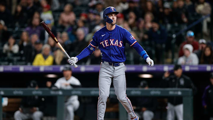 May 10, 2024; Denver, Colorado, USA; Texas Rangers outfielder Evan Carter (32) after striking out in the eighth inning against the Colorado Rockies at Coors Field. Mandatory Credit: Isaiah J. Downing-Imagn Images