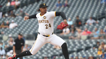 Aug 20, 2025; Pittsburgh, Pennsylvania, USA;  Pittsburgh Pirates starting pitcher Johan Oviedo (24) delivers a pitch against the Toronto Blue Jays during the first inning at PNC Park. Mandatory Credit: Charles LeClaire-Imagn Images