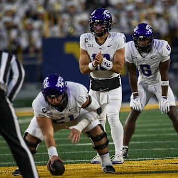 Josh Hoover and the offense prior to the snap