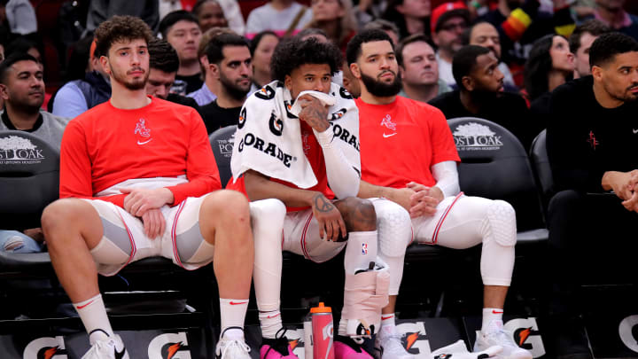 Dec 27, 2023; Houston, Texas, USA; (from L-to-R) Houston Rockets center Alperen Sengun (28), Houston Rockets guard Jalen Green (4) and Houston Rockets guard Fred VanVleet (5) sit on the bench during the fourth quarter against the Phoenix Suns at Toyota Center. Mandatory Credit: Erik Williams-USA TODAY Sports