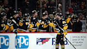 Dec 3, 2024; Pittsburgh, Pennsylvania, USA;  Pittsburgh Penguins defenseman Marcus Pettersson (28) celebrates with the bench after scoring a goal against the Florida Panthers during the third period at PPG Paints Arena. Mandatory Credit: Charles LeClaire-Imagn Images