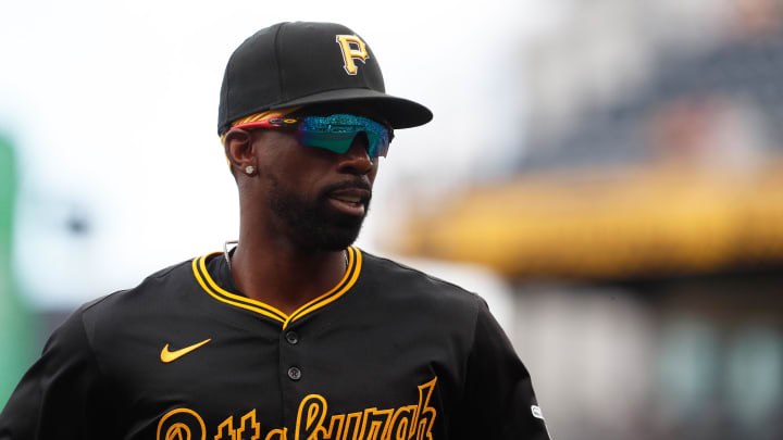 Jun 9, 2024; Pittsburgh, Pennsylvania, USA;  Pittsburgh Pirates right fielder Andrew McCutchen (22) jogs off of the field after securing the final out of the eighth inning against the Minnesota Twins at PNC Park. Mandatory Credit: Charles LeClaire-USA TODAY Sports