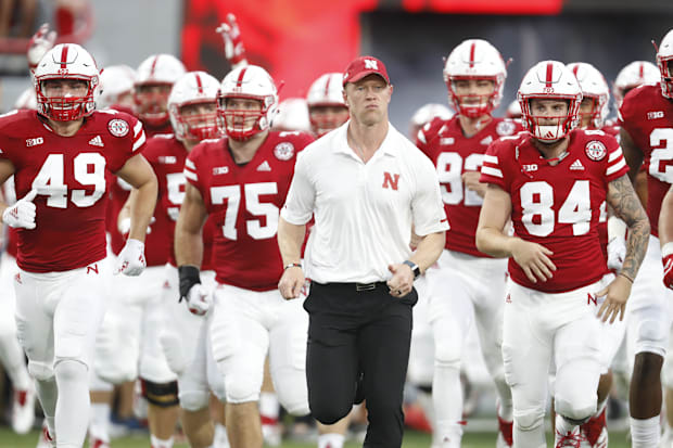 Nebraska Cornhuskers head coach Scott Frost leads the team onto the field for the game against the Akron Zips.