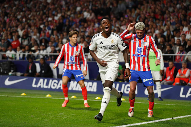 Real Madrid forward Vinicius celebrates scoring in the Madrid derby