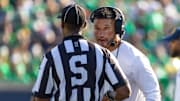 Oct 4, 2025; South Bend, Indiana, USA; Notre Dame Fighting Irish head coach Marcus Freeman talks to an official during the first half at Notre Dame Stadium. 