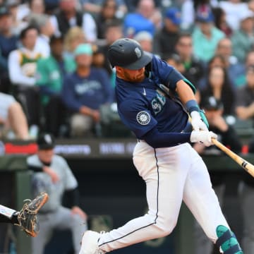 Seattle Mariners first baseman Tyler Locklear (27) hits a home run against the Chicago White Sox during the fifth inning at T-Mobile Park on June 13.