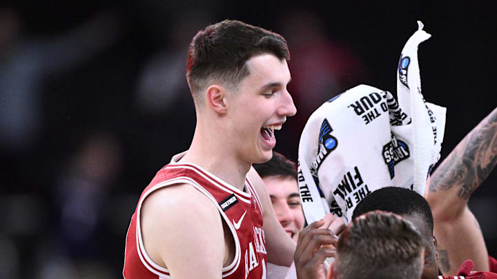 Mar 22, 2025; Providence, RI, USA; Arkansas Razorbacks forward Zvonimir Ivisic (44) and teammates celebrate after defeating the St. John's Red Storms in a second round men’s NCAA Tournament game at Amica Mutual Pavilion. Mandatory Credit: Brian Fluharty-Imagn Images