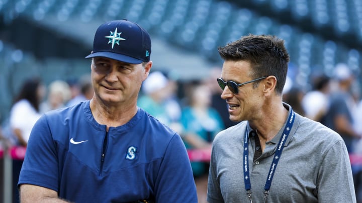 Seattle Mariners manager Scott Servais, left, and general manger Jerry Dipoto talk during batting practice against the New York Yankees at T-Mobile Park on July 27.