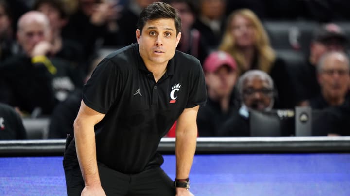 Cincinnati Bearcats head coach Wes Miller observes play in the second half of an NCAA college basketball game between the Houston Cougars and the Cincinnati Bearcats, Saturday, Feb. 10, 2024, at Fifth Third Arena in Cincinnati.