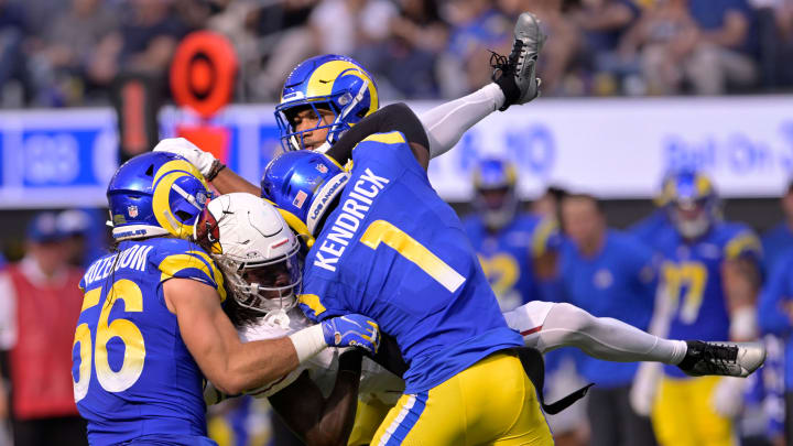 Oct 15, 2023; Inglewood, California, USA; Los Angeles Rams cornerback Derion Kendrick (1) drops Arizona Cardinals wide receiver Marquise Brown (center) for a tackle with linebacker Christian Rozeboom (56) and cornerback Ahkello Witherspoon (top center) during the second half at SoFi Stadium. Mandatory Credit: Alex Gallardo-USA TODAY Sports