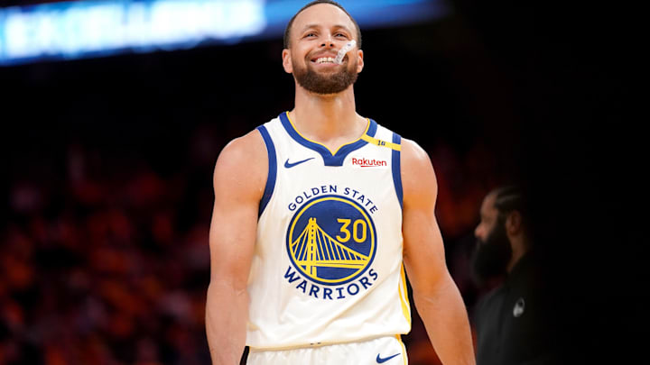 Golden State Warriors guard Stephen Curry (30) smiles after making a basket against the Memphis Grizzlies in the fourth quarter at the Chase Center. 
