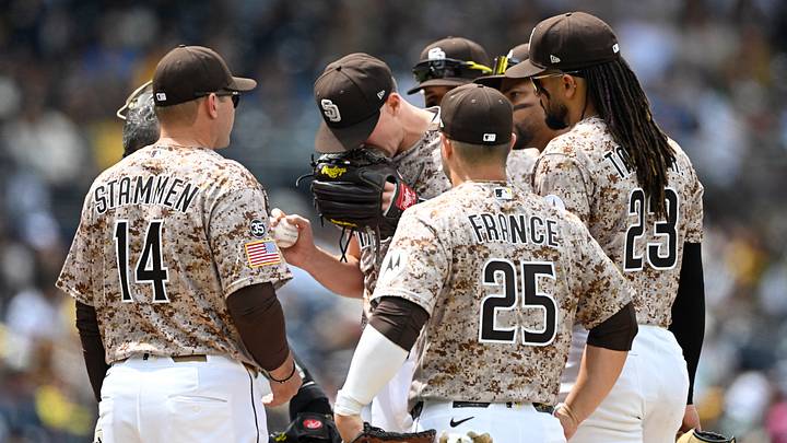 San Diego Padres starting pitcher Nick Pivetta surrounded by his teammates.