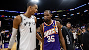 Nov 2, 2023; Phoenix, Arizona, USA; San Antonio Spurs center Victor Wembanyama (1) talks with Phoenix Suns forward Kevin Durant (35) following the game at Footprint Center. Mandatory Credit: Mark J. Rebilas-Imagn Images