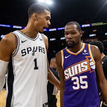 Nov 2, 2023; Phoenix, Arizona, USA; San Antonio Spurs center Victor Wembanyama (1) talks with Phoenix Suns forward Kevin Durant (35) following the game at Footprint Center. Mandatory Credit: Mark J. Rebilas-Imagn Images