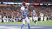 Nov 13, 2025; Foxborough, Massachusetts, USA; New England Patriots quarterback Drake Maye (10) throws a touchdown pass to New England Patriots running back TreVeyon Henderson (32) during the first half at Gillette Stadium. Mandatory Credit: Eric Canha-Imagn Images
