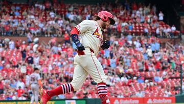 Jun 22, 2024; St. Louis, Missouri, USA; St. Louis Cardinals outfielder Brendan Donovan (33) reaches first base on his way around the bases after hitting a home run against the San Francisco Giants  at Busch Stadium. Mandatory Credit: Tim Vizer-USA TODAY Sports