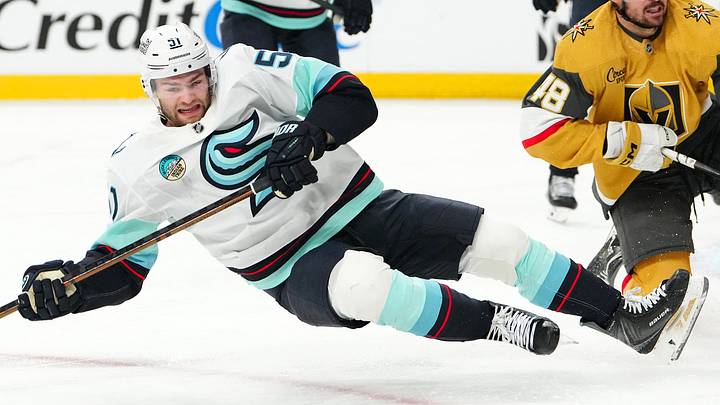 Apr 15, 2026; Las Vegas, Nevada, USA; Seattle Kraken center Shane Wright (51) is tripped up by Vegas Golden Knights center Tomas Hertl (48) during the second period at T-Mobile Arena. Mandatory Credit: Stephen R. Sylvanie-Imagn Images