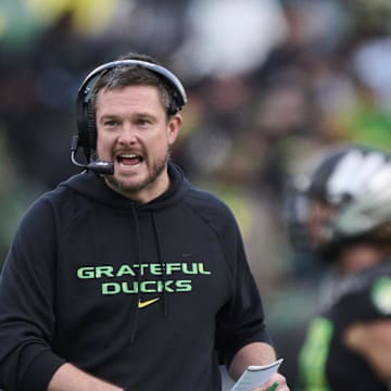 Oct 25, 2025; Eugene, Oregon, USA; Oregon Ducks head coach Dan Lanning instructs players during the first half against the Wisconsin Badgers at Autzen Stadium. Mandatory Credit: Troy Wayrynen-Imagn Images