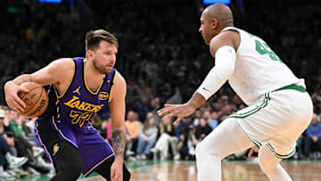 Los Angeles Lakers guard Luka Doncic (77) drives to the basket against Boston Celtics center Al Horford (42) during the second quarter at the TD Garden.