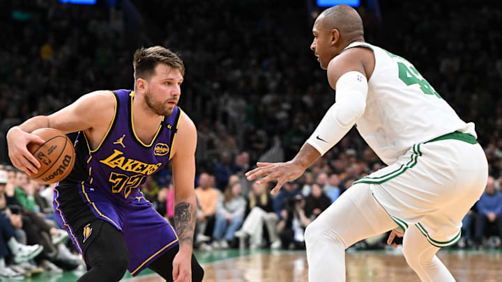 Los Angeles Lakers guard Luka Doncic (77) drives to the basket against Boston Celtics center Al Horford (42) during the second quarter at the TD Garden.