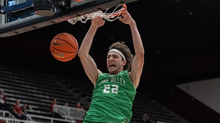 Dec 3, 2024; Stanford, California, USA; Utah Valley Wolverines forward Carter Welling (22) dunks the basketball against the Stanford Cardinal during the second half at Maples Pavilion. Mandatory Credit: Neville E. Guard-Imagn Images