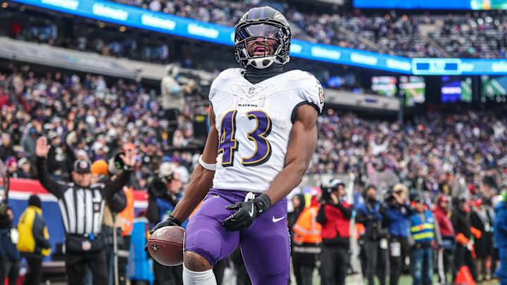 Dec 15, 2024; East Rutherford, New Jersey, USA; Baltimore Ravens running back Justice Hill (43) scores a touchdown reception during the second half against the New York Giants at MetLife Stadium. Mandatory Credit: Vincent Carchietta-Imagn Images