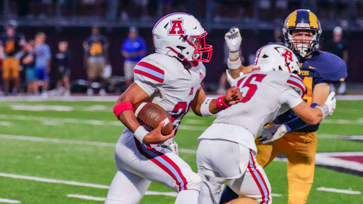 Arrowhead's Jacob Siner (20) breaks loose for a 71-yard touchdown run during a non-conference season opener against Marquette at Menomonee Falls on Friday, August 22, 2025. Arrowhead's Jacob Siner (20) breaks loose for a 71-yard touchdown run during a non-conference season opener against Marquette at Menomonee Falls on Friday, August 22, 2025.