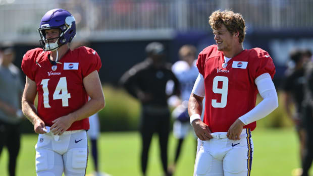 Minnesota Vikings quarterback J.J. McCarthy (9) and quarterback Sam Darnold (14)