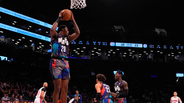 Apr 6, 2024; Brooklyn, New York, USA; Brooklyn Nets point center Day'Ron Sharpe (20) grabs a rebound against the Detroit Pistons  during the first half at Barclays Center. Mandatory Credit: Gregory Fisher-Imagn Images