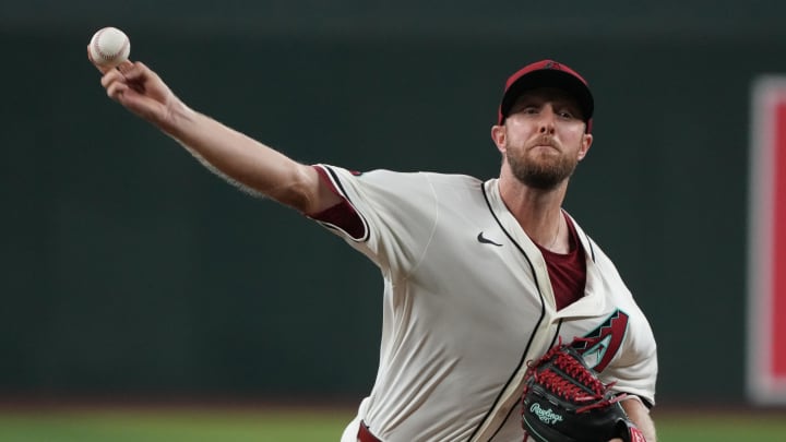 Aug 11, 2024; Phoenix, Arizona, USA; Arizona Diamondbacks pitcher Merrill Kelly (29) throws against the Philadelphia Phillies in the first inning at Chase Field. Mandatory Credit: Rick Scuteri-USA TODAY Sports