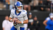 Nov 22, 2025; Nashville, Tennessee, USA;  Kentucky Wildcats quarterback Cutter Boley (8) scrambles against the Vanderbilt Commodores during the first half at FirstBank Stadium. Mandatory Credit: Steve Roberts-Imagn Images