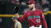 Aug 6, 2025; Phoenix, Arizona, USA; Arizona Diamondbacks pitcher Kyle Backhus (43) reacts after allowing a home run to San Diego Padres first base Ryan O'Hearn (32) during the ninth inning at Chase Field. Mandatory Credit: Joe Camporeale-Imagn Images