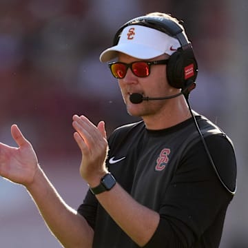 Aug 30, 2025; Los Angeles, California, USA; Southern California Trojans head coach Lincoln Riley watches from the sidelines against the Missouri State Bears in the first half at United Airlines Field at Los Angeles Memorial Coliseum. Mandatory Credit: Kirby Lee-Imagn Images