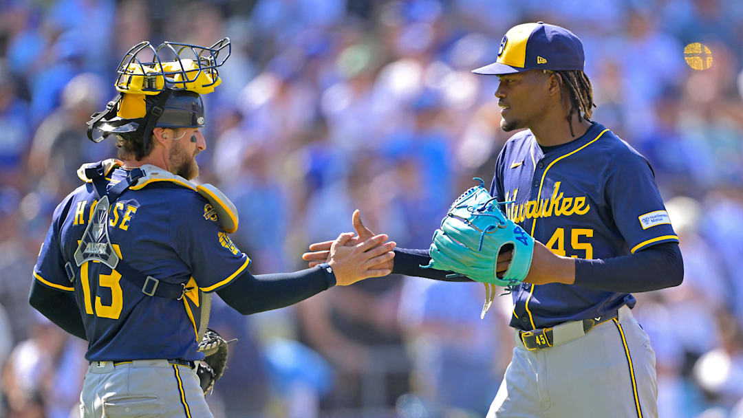 Milwaukee Brewers players Eric Haase and Abner Uribe celebrate against the Los Angeles Dodgers.