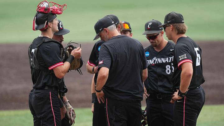 Cincinnati head baseball coach Jordan Bischel has a meeting at the pitchers mound during a NCAA regional baseball game between the Cincinnati Bearcats and Wake Forest Demon Deacons at Lindsey Nelson Stadium in Knoxville, Tenn., on June 1, 2025.