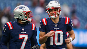 Dec 28, 2024; Foxborough, Massachusetts, USA; New England Patriots quarterback Drake Maye (10) and quarterback Jacoby Brissett (7) warm up before the start of the game against the Los Angeles Chargers at Gillette Stadium. Mandatory Credit: David Butler II-Imagn Images